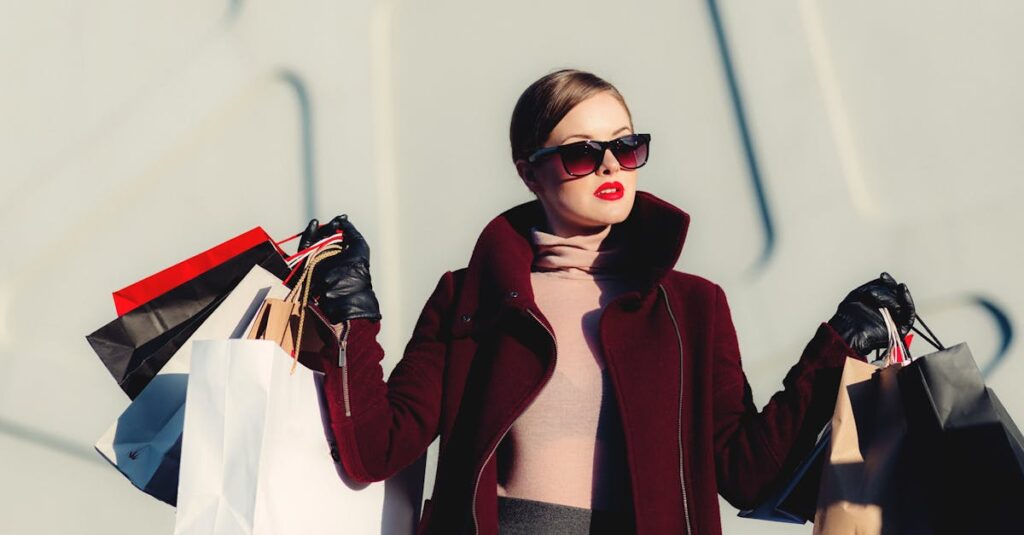 Stylish young woman in sunglasses carrying shopping bags outdoors. Elegant fashion statement.